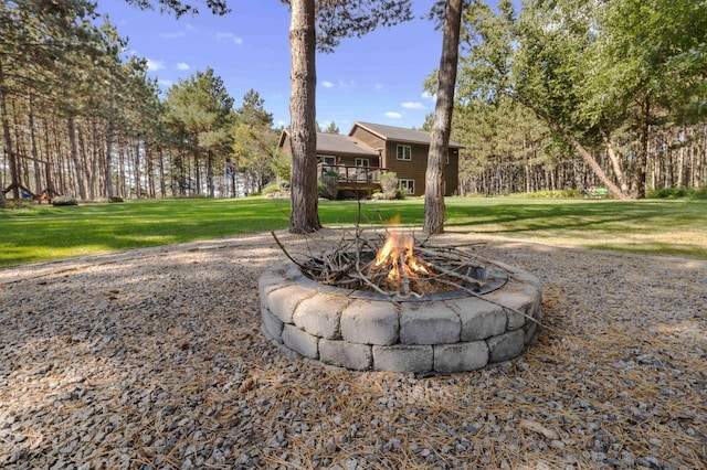 12584 County 18 SW, Brainerd, MN 56401 - view of grassy yard featuring a fire pit and a deck