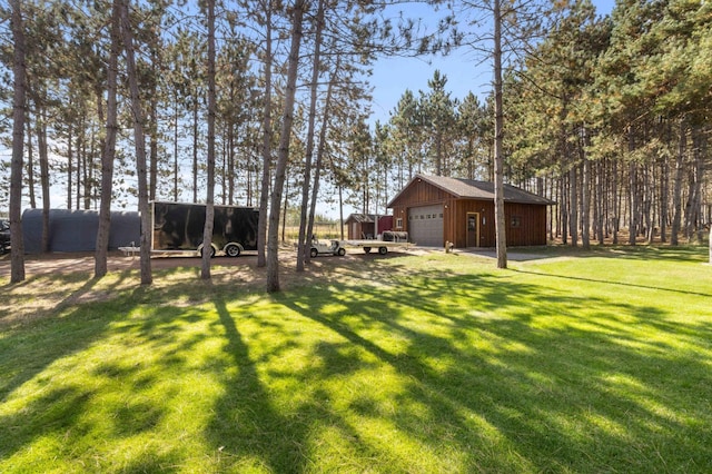 12584 County 18 SW, Brainerd, MN 56401 - view of grassy yard with a detached garage and an outdoor structure