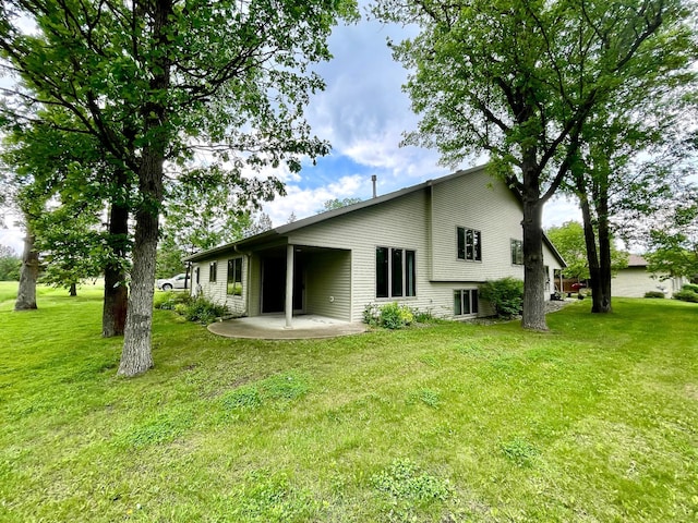 416 Rako St SW, Bemidji, MN 56601 - rear view of property featuring a patio and a yard