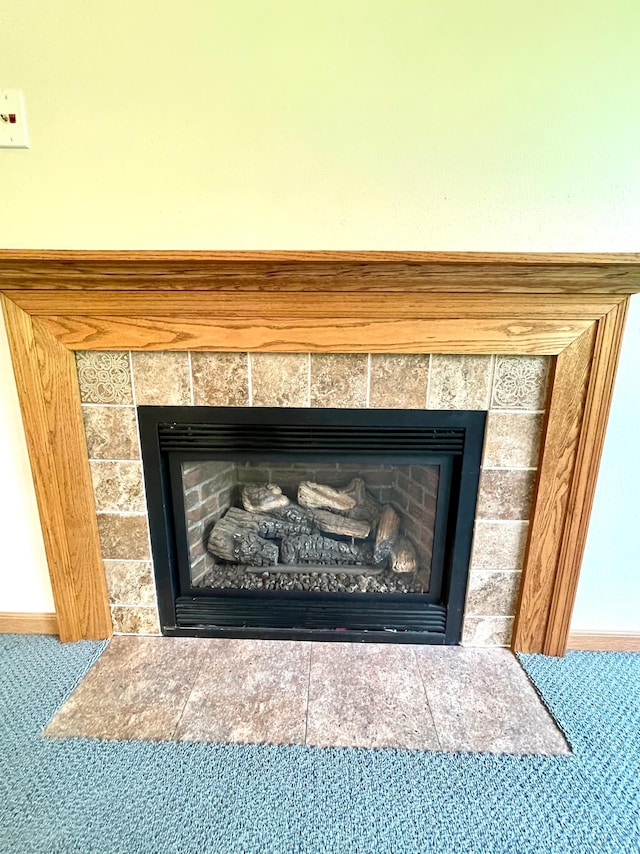 416 Rako St SW, Bemidji, MN 56601 - detailed view of a fireplace, carpet floors, and baseboards
