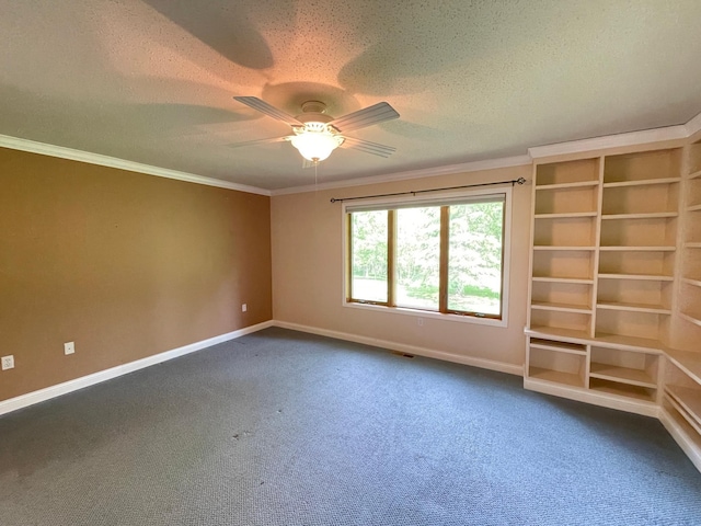 416 Rako St SW, Bemidji, MN 56601 - unfurnished room featuring baseboards, a ceiling fan, crown molding, dark colored carpet, and a textured ceiling