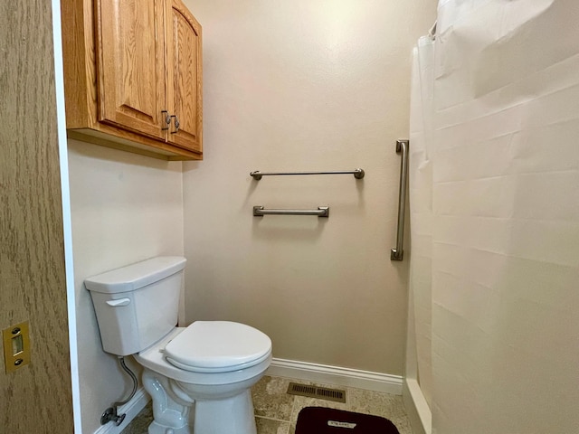 416 Rako St SW, Bemidji, MN 56601 - full bathroom featuring baseboards, toilet, curtained shower, and tile patterned flooring