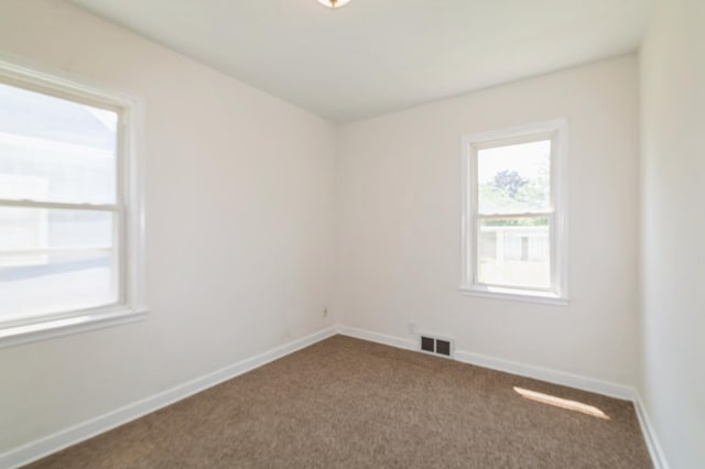 1576 Nebraska Ave E, Saint Paul, MN 55106 - empty room with dark carpet and baseboards