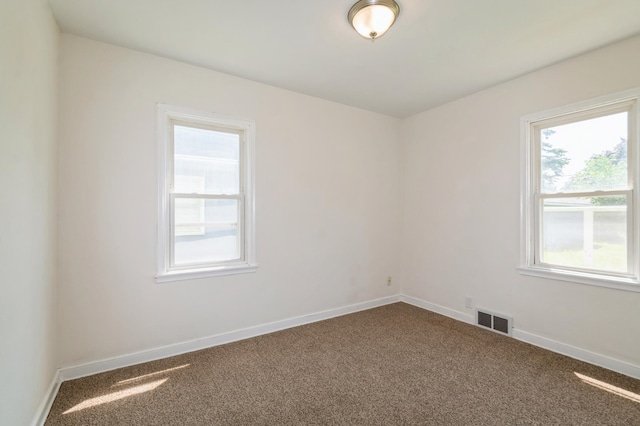 1576 Nebraska Ave E, Saint Paul, MN 55106 - unfurnished room featuring dark carpet and baseboards