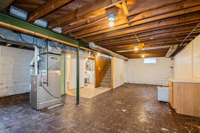 1576 Nebraska Ave E, Saint Paul, MN 55106 - below grade area featuring heating unit, stairs, tile patterned floors, and washer / clothes dryer