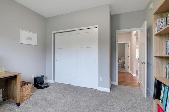 6645 91st St S, Cottage Grove, MN 55016 - unfurnished bedroom featuring carpet floors, a closet, and baseboards