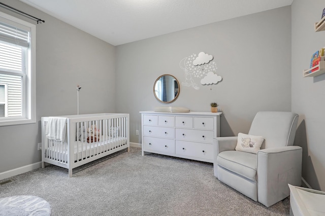 6645 91st St S, Cottage Grove, MN 55016 - carpeted bedroom with a nursery area, multiple windows, and baseboards