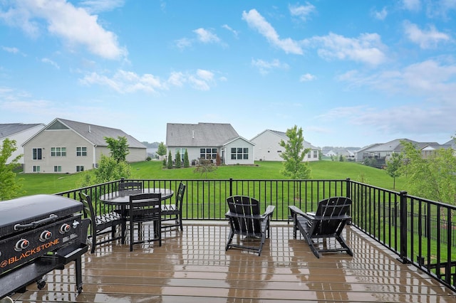 6645 91st St S, Cottage Grove, MN 55016 - deck featuring a residential view, outdoor dining space, a yard, and a grill