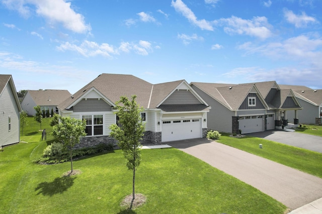 6645 91st St S, Cottage Grove, MN 55016 - craftsman inspired home featuring asphalt driveway, stone siding, an attached garage, a front yard, and board and batten siding