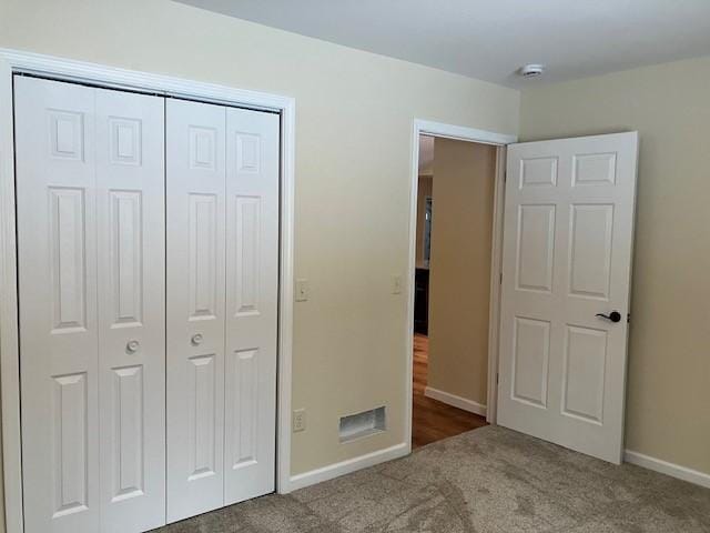 7865 Ski Chalet Dr, Breezy Point, MN 56472 - unfurnished bedroom featuring carpet, a closet, and baseboards