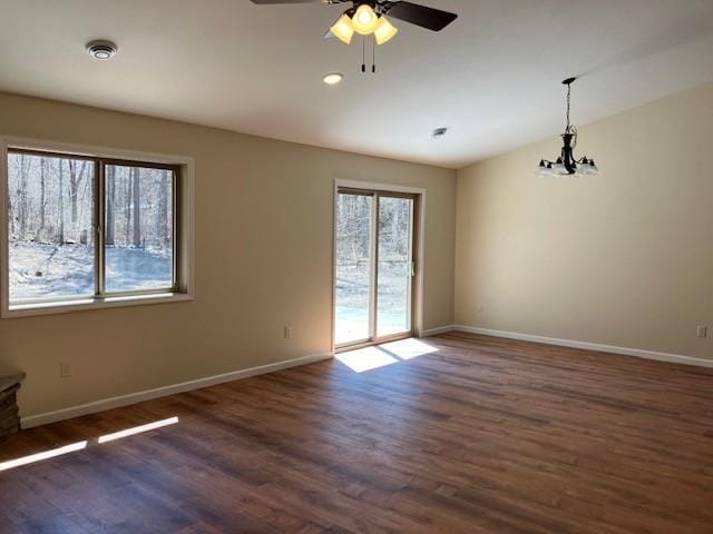 7865 Ski Chalet Dr, Breezy Point, MN 56472 - unfurnished room with baseboards, ceiling fan, wood finished floors, and a chandelier