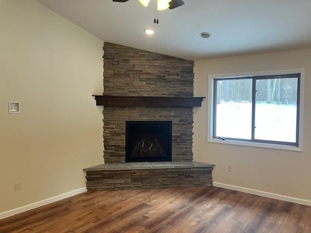 7865 Ski Chalet Dr, Breezy Point, MN 56472 - unfurnished living room with ceiling fan, lofted ceiling, wood finished floors, baseboards, and a fireplace