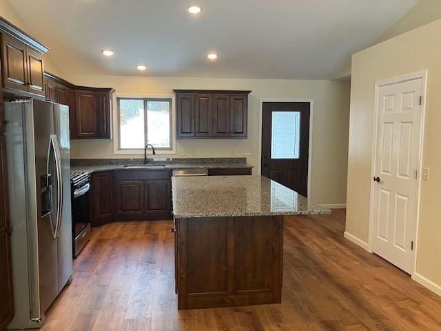 7865 Ski Chalet Dr, Breezy Point, MN 56472 - kitchen featuring stainless steel fridge with ice dispenser, a sink, dark brown cabinetry, range with gas stovetop, and a center island