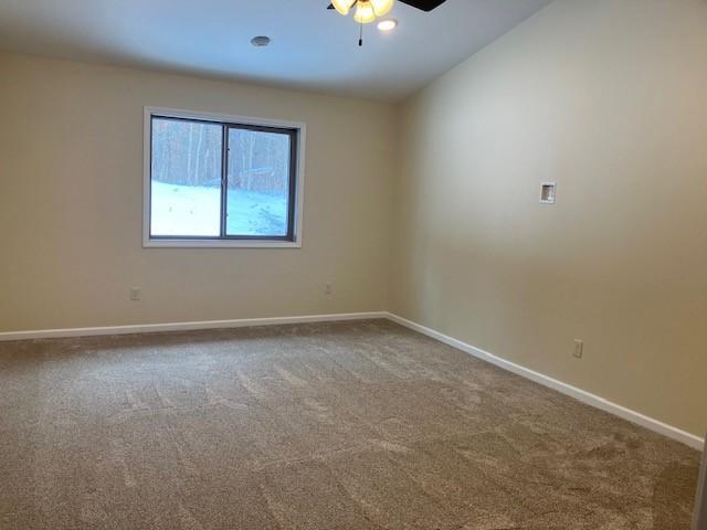 7865 Ski Chalet Dr, Breezy Point, MN 56472 - carpeted spare room with a ceiling fan and baseboards