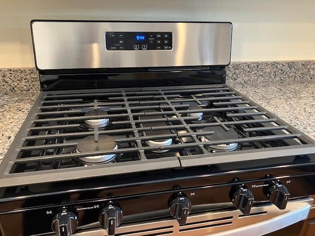 7865 Ski Chalet Dr, Breezy Point, MN 56472 - detailed view of stainless steel gas range and light countertops