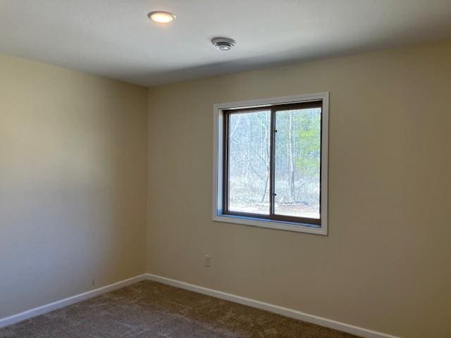 7865 Ski Chalet Dr, Breezy Point, MN 56472 - empty room with dark colored carpet and baseboards