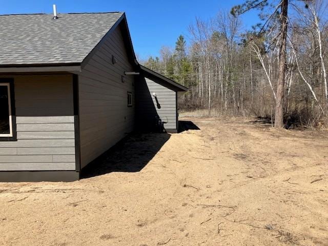 7865 Ski Chalet Dr, Breezy Point, MN 56472 - view of side of property with roof with shingles
