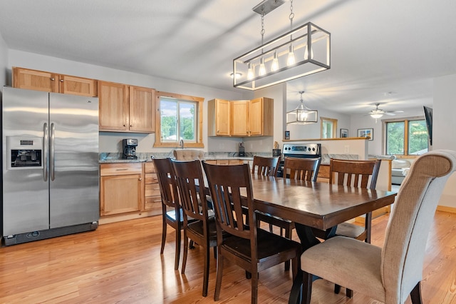 1874 Hidden Valley Ln NW, Leaf Valley Twp, MN 56354 - dining space with healthy amount of natural light, light wood finished floors, and ceiling fan