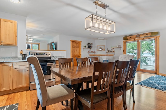 1874 Hidden Valley Ln NW, Leaf Valley Twp, MN 56354 - dining room with light wood-style floors and ceiling fan