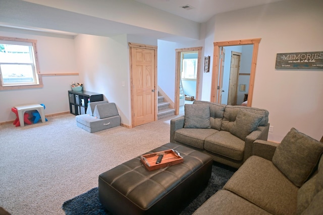1874 Hidden Valley Ln NW, Leaf Valley Twp, MN 56354 - living area with stairway, carpet flooring, and healthy amount of natural light