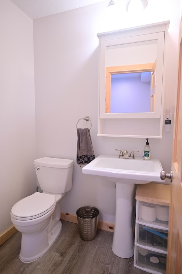 1874 Hidden Valley Ln NW, Leaf Valley Twp, MN 56354 - half bath with wood finished floors and toilet