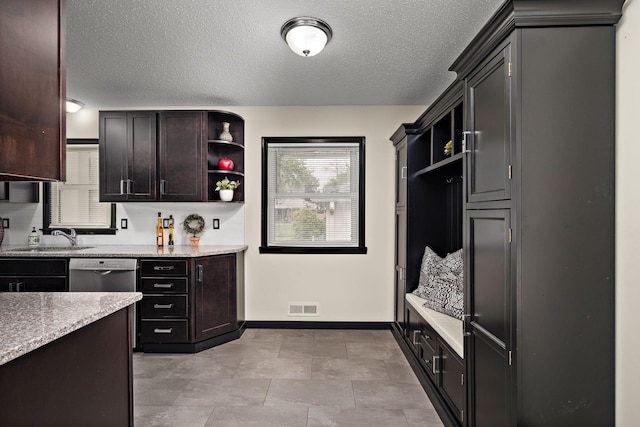 11627 Yukon St NW, Coon Rapids, MN 55433 - kitchen with open shelves, a sink, stainless steel dishwasher, baseboards, and light stone countertops