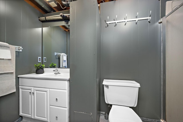 11627 Yukon St NW, Coon Rapids, MN 55433 - bathroom featuring vanity, toilet, and a shower stall