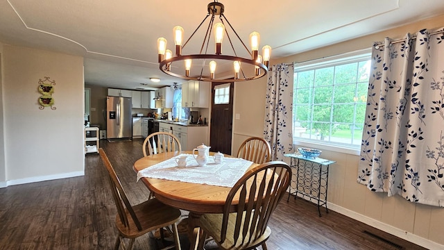 111 10th Ave SE, Elbow Lake, MN 56531 - dining room with dark wood finished floors, baseboards, and a chandelier