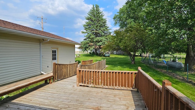 111 10th Ave SE, Elbow Lake, MN 56531 - wooden deck with a lawn