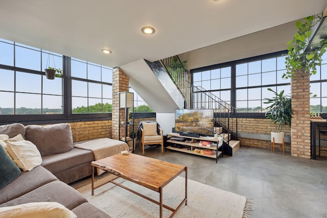 730 Stinson Blvd Unit 425, Minneapolis, MN 55413 - living room featuring brick wall, finished concrete floors, and recessed lighting