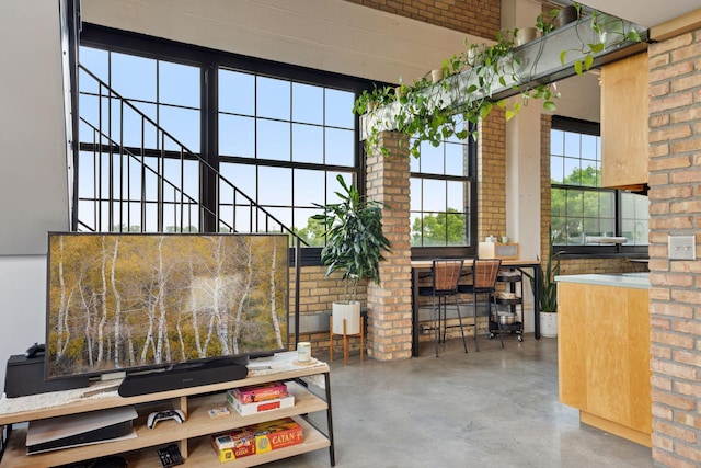 730 Stinson Blvd Unit 425, Minneapolis, MN 55413 - common area featuring brick wall and a high ceiling