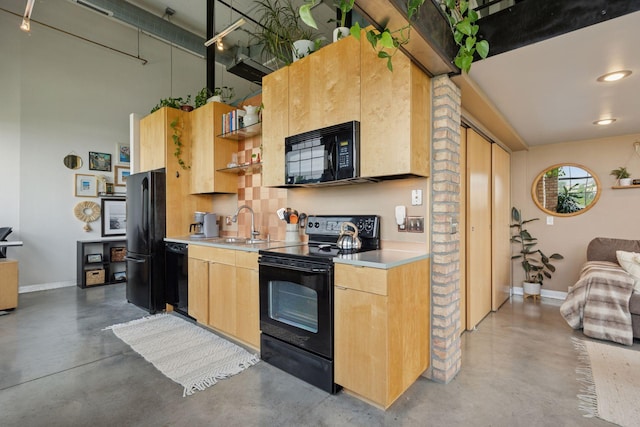 730 Stinson Blvd Unit 425, Minneapolis, MN 55413 - kitchen featuring black appliances, concrete floors, light brown cabinetry, and light countertops