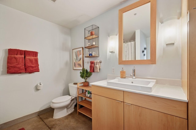 730 Stinson Blvd Unit 425, Minneapolis, MN 55413 - full bath featuring vanity, toilet, tile patterned flooring, and baseboards