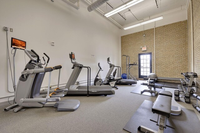 730 Stinson Blvd Unit 425, Minneapolis, MN 55413 - gym with a towering ceiling, brick wall, and carpet floors
