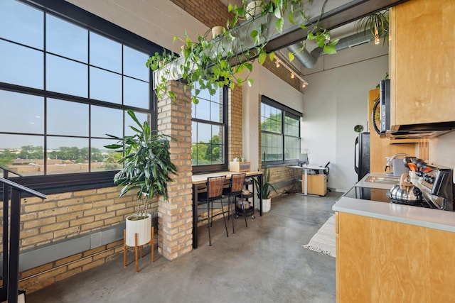 730 Stinson Blvd Unit 425, Minneapolis, MN 55413 - view of patio / terrace with a sink, outdoor dining area, and an outdoor kitchen