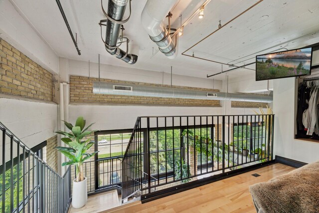 730 Stinson Blvd Unit 425, Minneapolis, MN 55413 - corridor with wood finished floors and brick wall