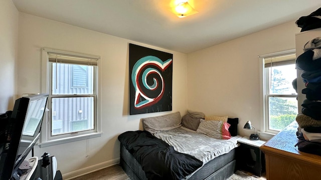 2212 Springvale Ct, Duluth, MN 55811 - bedroom with multiple windows, wood finished floors, and baseboards