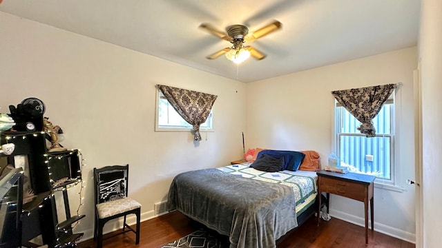 2212 Springvale Ct, Duluth, MN 55811 - bedroom with baseboards, wood finished floors, and a ceiling fan