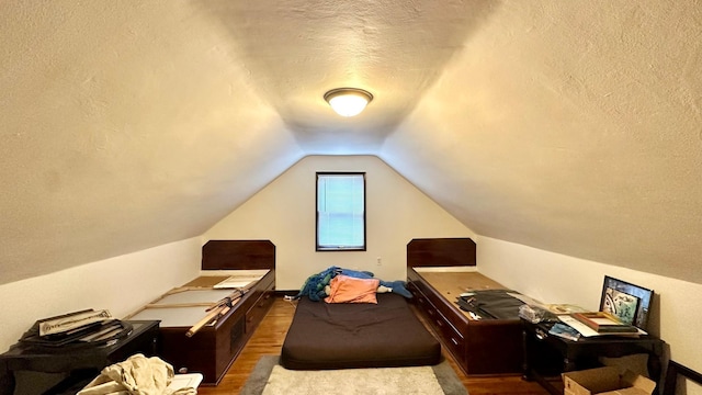 2212 Springvale Ct, Duluth, MN 55811 - office area featuring wood finished floors, a textured ceiling, and vaulted ceiling