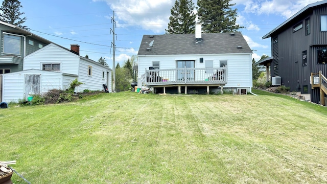 2212 Springvale Ct, Duluth, MN 55811 - back of property with a deck, central AC unit, a yard, and roof with shingles