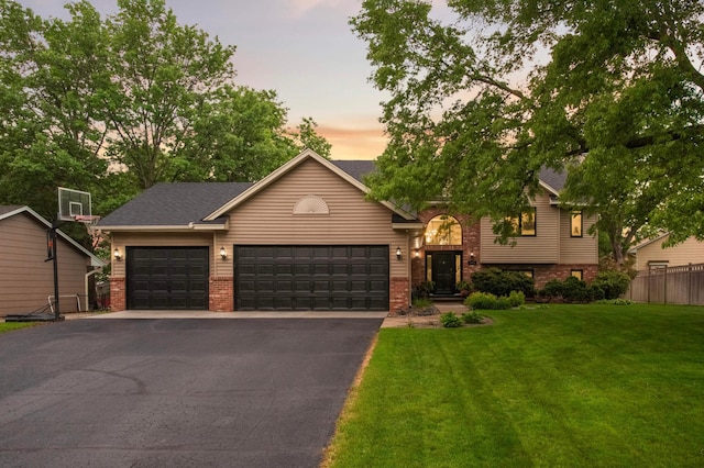 1366 140th Ln NW, Andover, MN 55304 - view of front of home with driveway, brick siding, and an attached garage