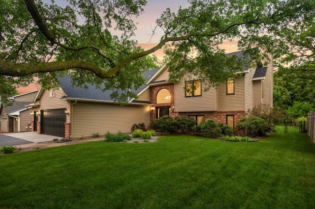 1366 140th Ln NW, Andover, MN 55304 - view of front of home featuring brick siding, asphalt driveway, an attached garage, and a shingled roof