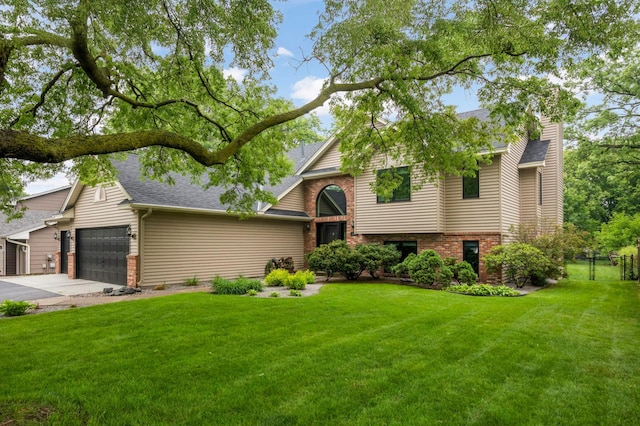 1366 140th Ln NW, Andover, MN 55304 - view of front of property featuring brick siding, an attached garage, driveway, and a shingled roof