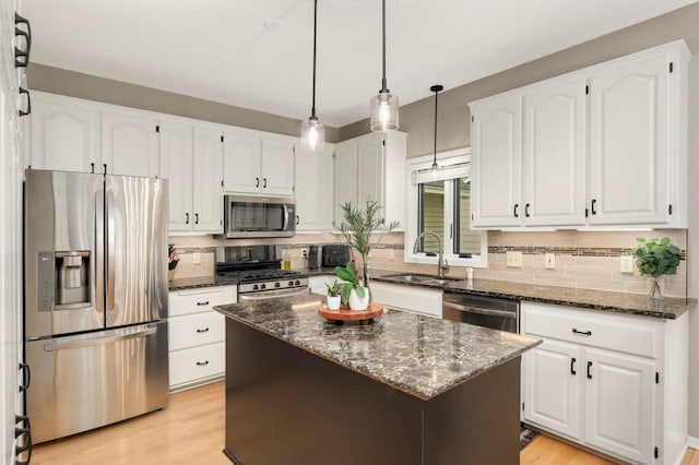 1366 140th Ln NW, Andover, MN 55304 - kitchen with appliances with stainless steel finishes, a sink, backsplash, and dark stone counters