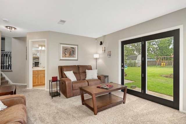 1366 140th Ln NW, Andover, MN 55304 - living room with light colored carpet, stairs, and baseboards