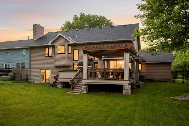 1366 140th Ln NW, Andover, MN 55304 - back of property at dusk featuring a pergola, a deck, a chimney, central air condition unit, and roof with shingles