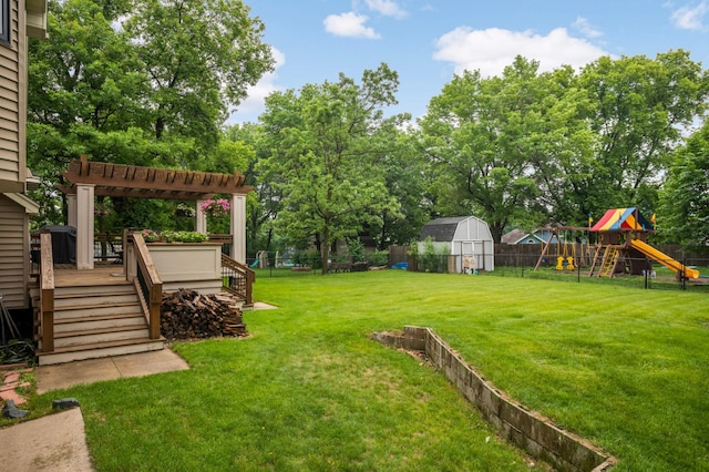 1366 140th Ln NW, Andover, MN 55304 - view of yard featuring a playground, a pergola, a deck, and view of wooded area