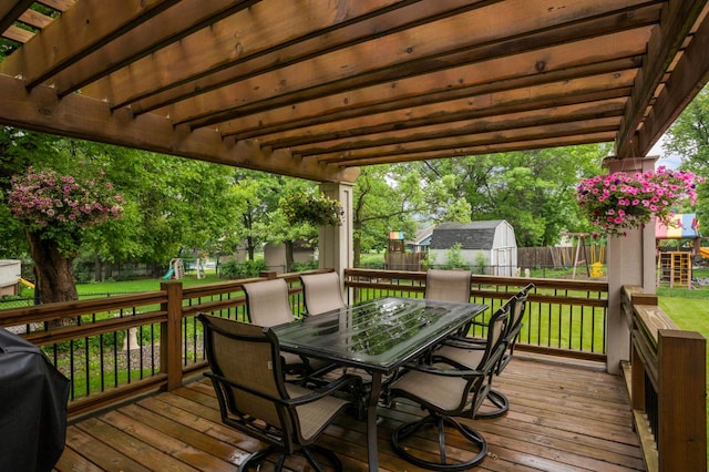 1366 140th Ln NW, Andover, MN 55304 - wooden terrace with outdoor dining area, a playground, and area for grilling