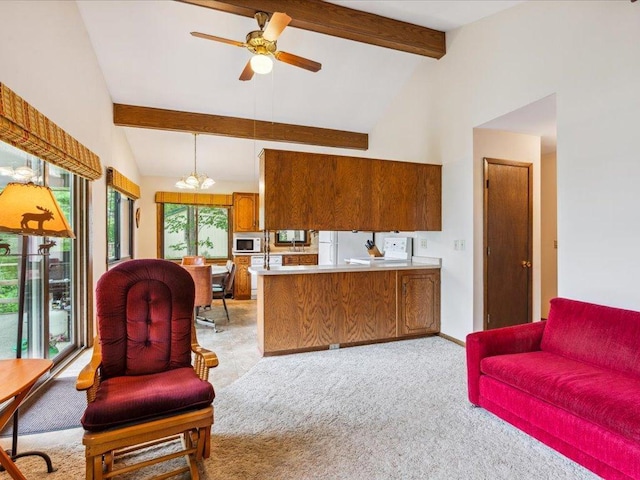 1474 Shamineau Dr, Motley, MN 56466 - living room with light carpet, beamed ceiling, a chandelier, ceiling fan, and high vaulted ceiling