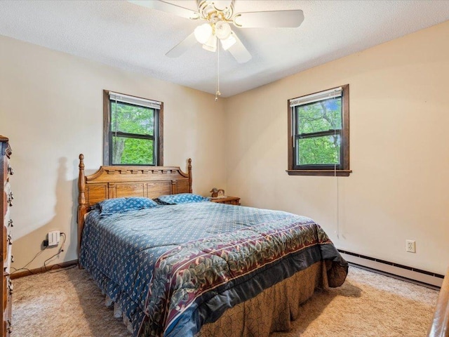 1474 Shamineau Dr, Motley, MN 56466 - carpeted bedroom featuring baseboard heating, a ceiling fan, and a textured ceiling
